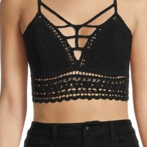 Madden NYC black crochet trim crop top with a floral tie-back. Size:Medium
